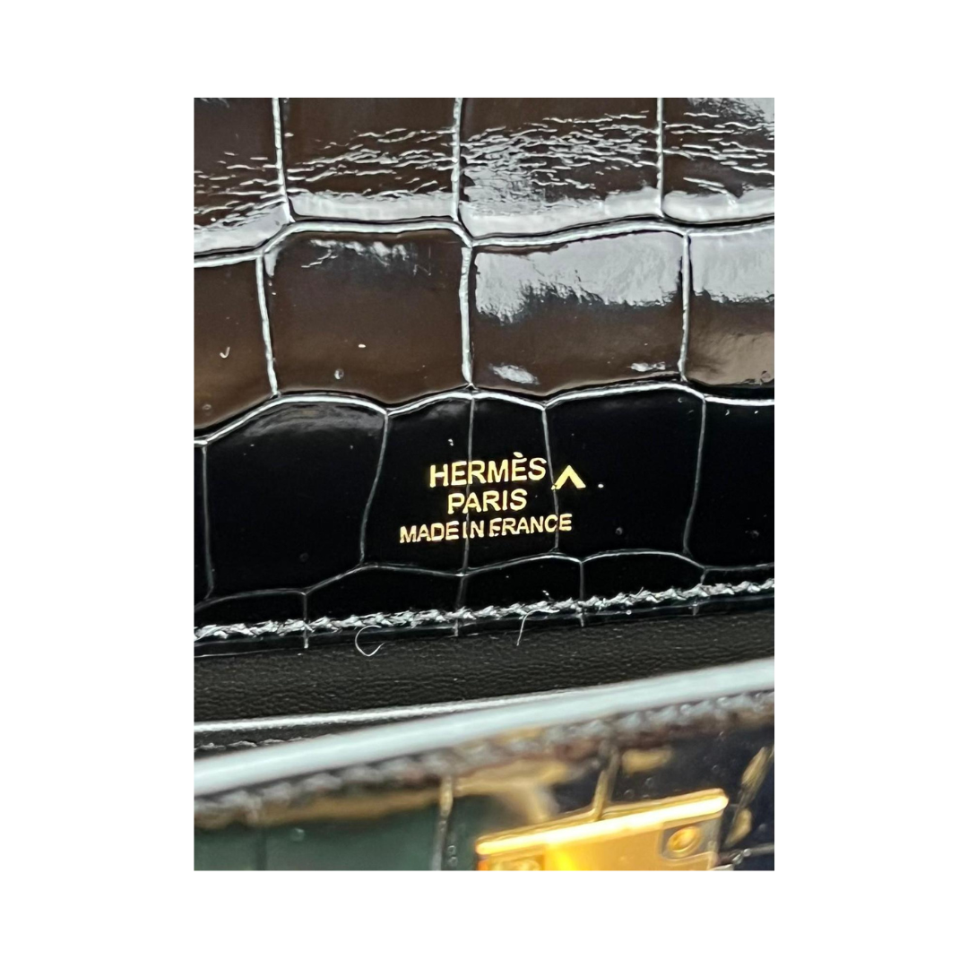 Kelly pochette black porosus lisse ghw