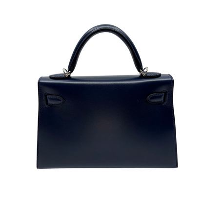 Kelly mini stud bleu abysse veau box