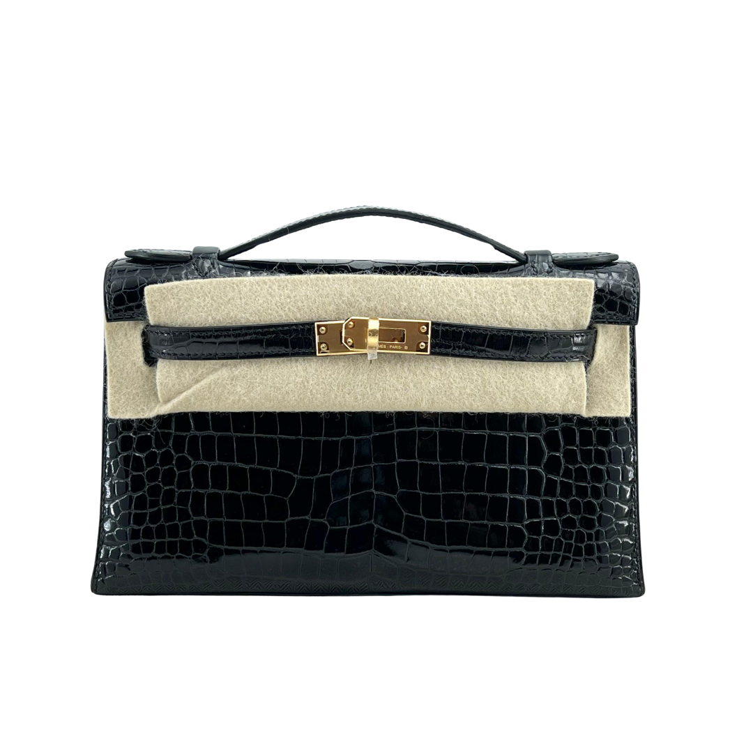 Kelly pochette black porosus lisse ghw