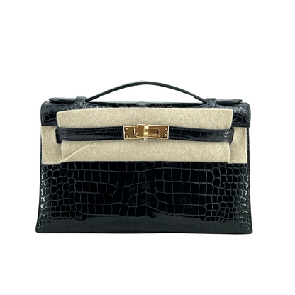 Kelly pochette black porosus lisse ghw