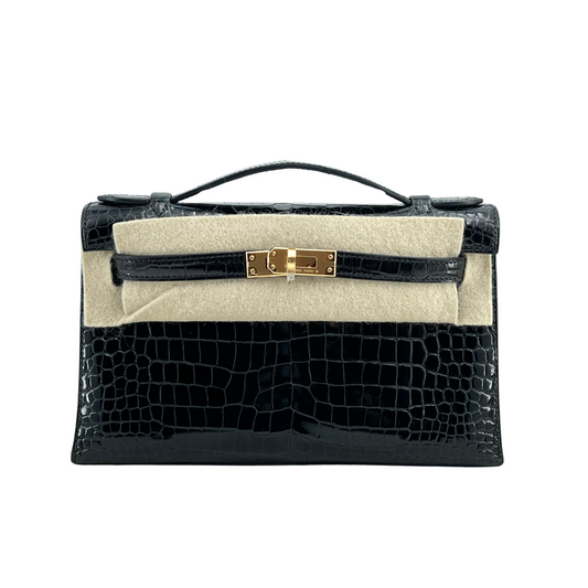 Kelly pochette black porosus lisse ghw